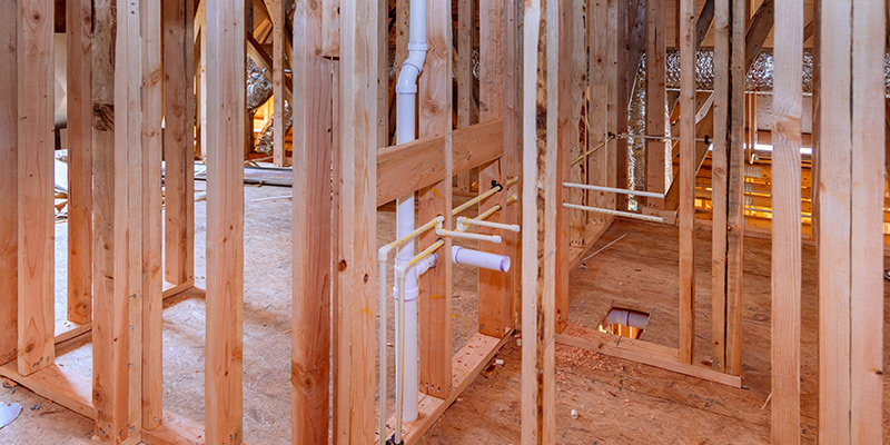 Plumbing in wood framing.